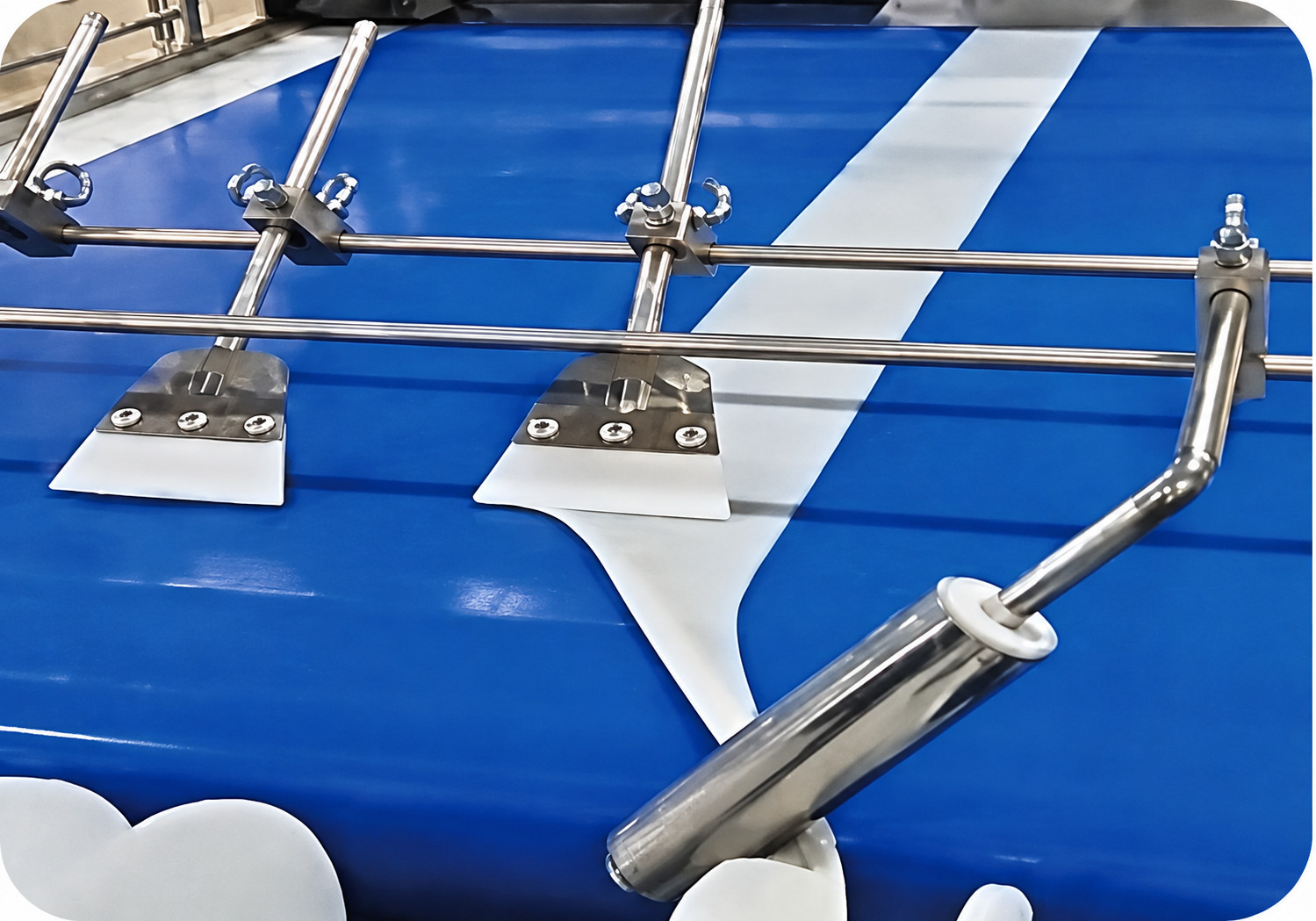 Close-up of conveyor and processing components on a YUKE crab stick line