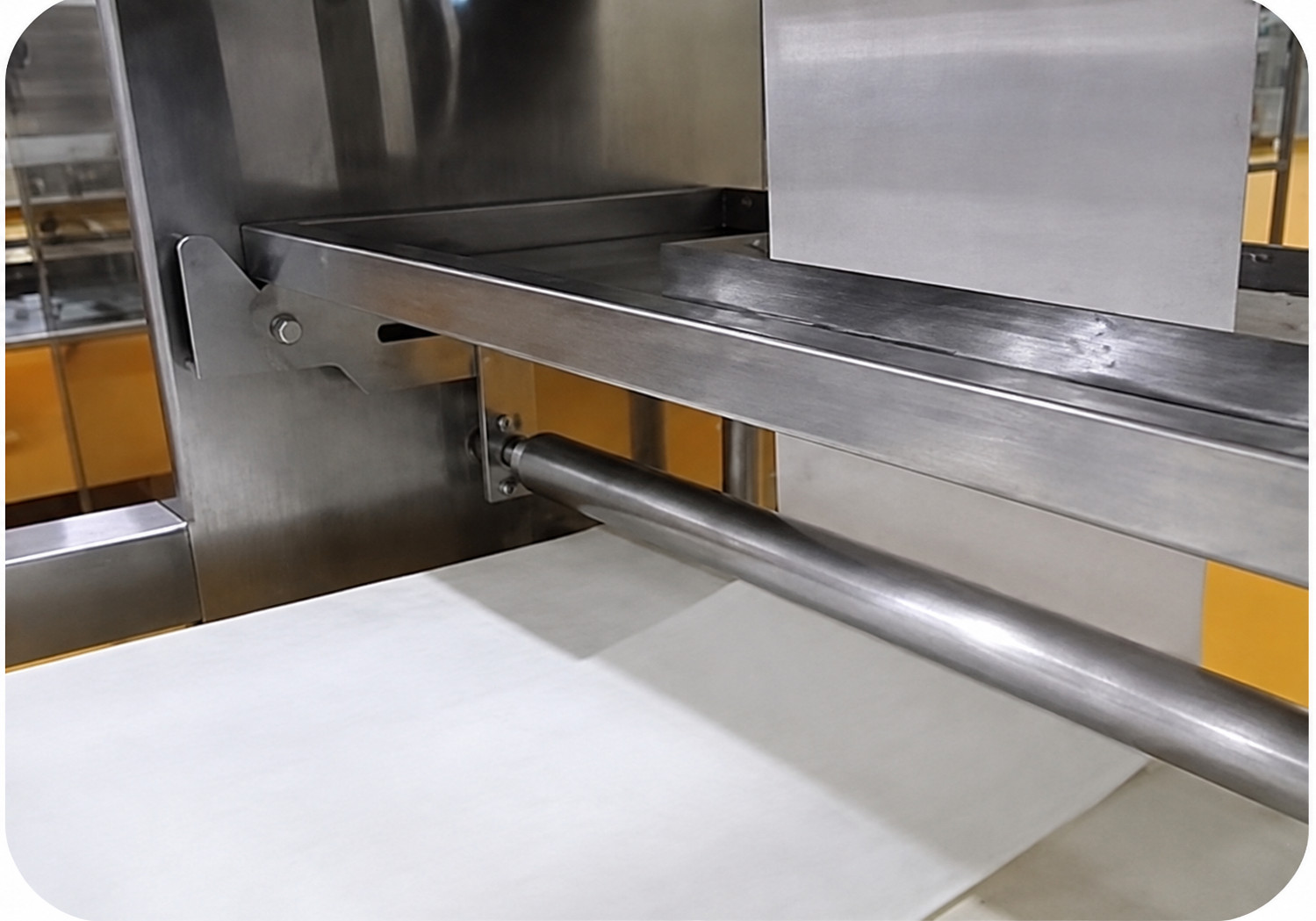 Close-up of conveyor and processing components on a YUKE crab stick line